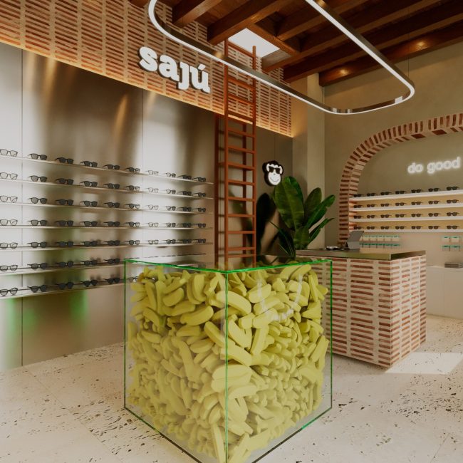 Interior de Sajú CTG en Cartagena con exhibición metálica, arco de ladrillo y pieza central amarilla